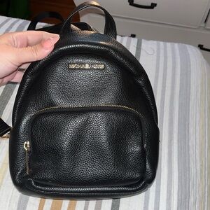 Black Micheal kors small backpack purse